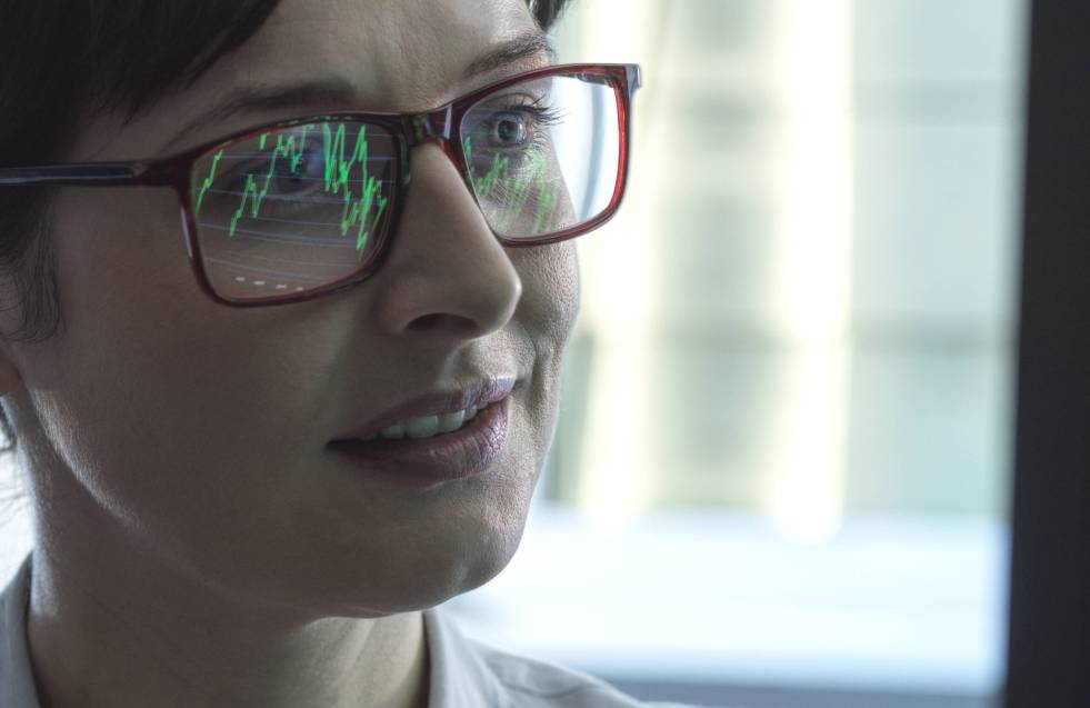 Business women viewing a graph showing company performance